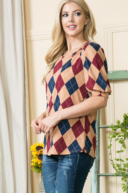 Versatile for both work and weekend — argyle motif meets dramatic sleeves.