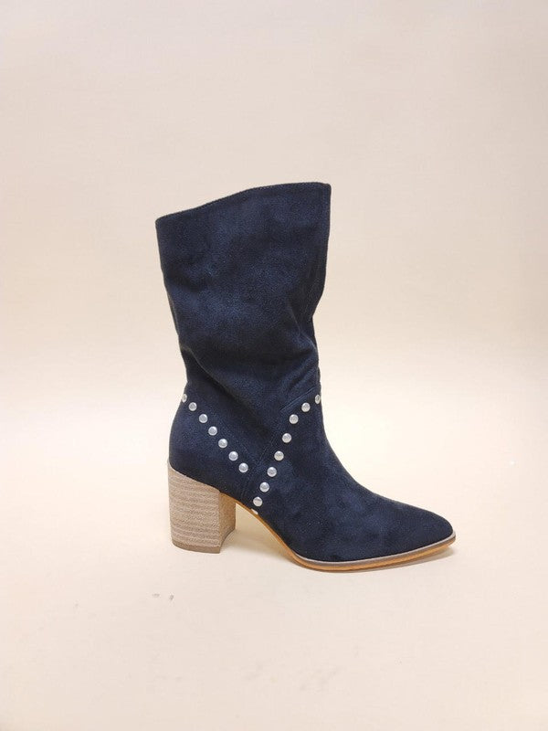 Slouchy knee-high boots in suede featuring metal stud trim, pointed toe silhouette, and chunky stacked heel design
