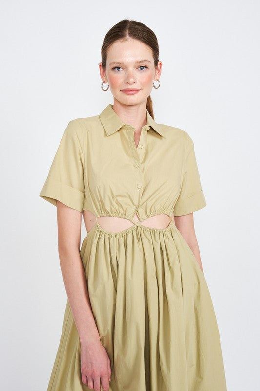 Woman models a stylish olive green midi dress with a collar, short sleeves, and fashionable cut-outs, portrait view.
