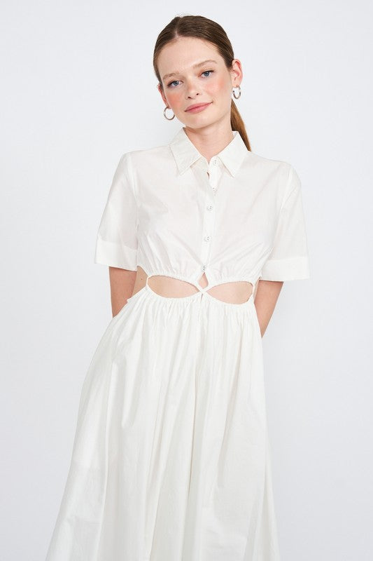 Woman models a white midi dress with a collar, short sleeves, and trendy cut-out details, portrait view.