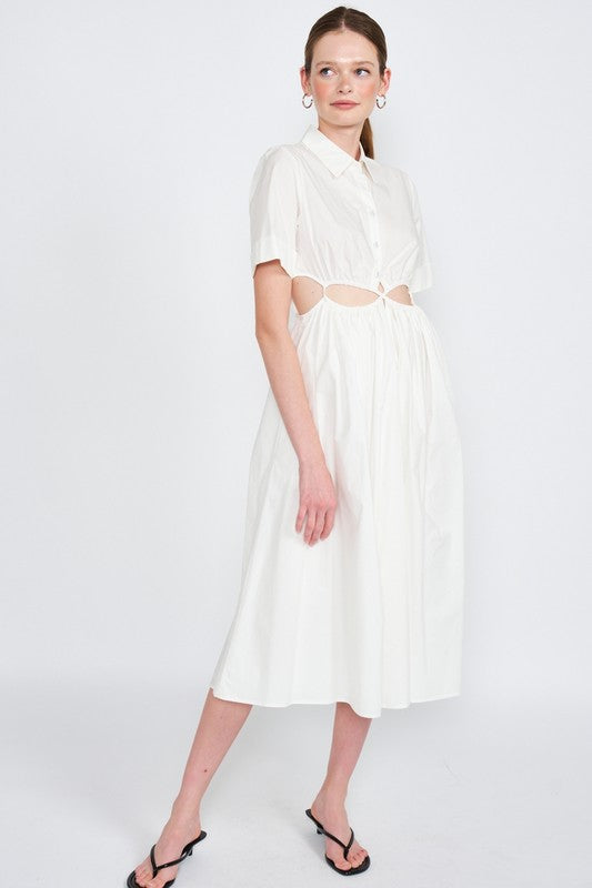 Woman models a white midi dress with a collar, short sleeves, and trendy cut-out details, full view.