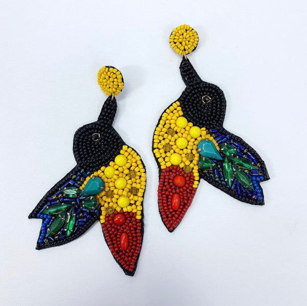 An image of a vibrant, multicolored statement earrings with a tropical-inspired design, bold, artistic, and perfect for adding flair to a casual look.