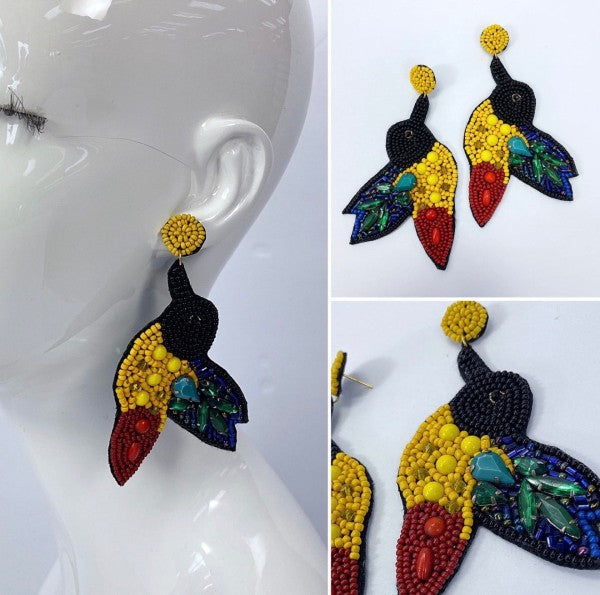 An image of a vibrant, multicolored statement earrings with a tropical-inspired design, bold, artistic, and perfect for adding flair to a casual look.