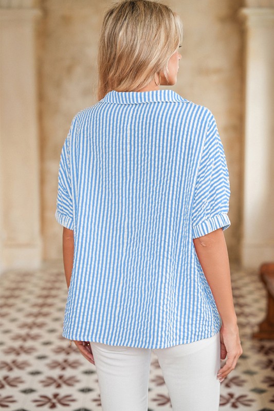 Vertical blue stripes elongate and flatter the silhouette.