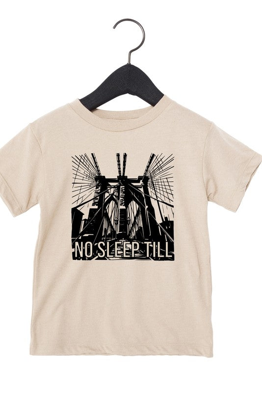 Beige t-shirt with black graphic design and 'No Sleep Till' text on a hanger against a white background