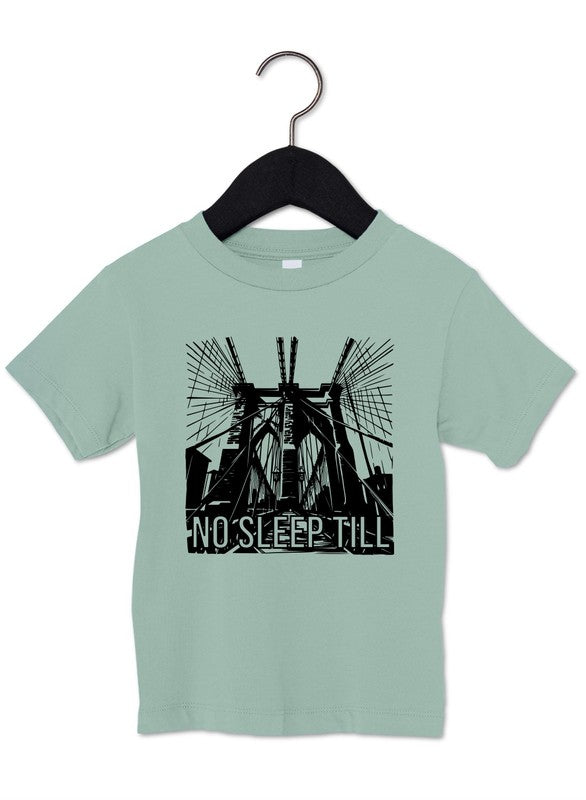 Light green t-shirt with a black graphic and 'No Sleep Till' text on a hanger against a white background