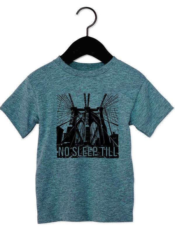 Blue t-shirt with graphic design and 'No Sleep Till' text on a hanger against a white background