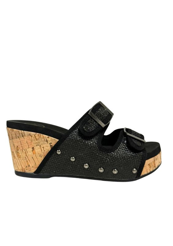 Platform wedge sandals with dual buckle straps, studded detail, open-toe design, cork wedge heel, and slip-on style