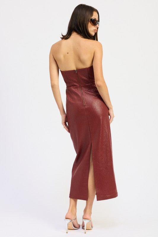 A woman models a sleek, strapless midi dress with a textured finish, ideal for a chic evening look, back view.
