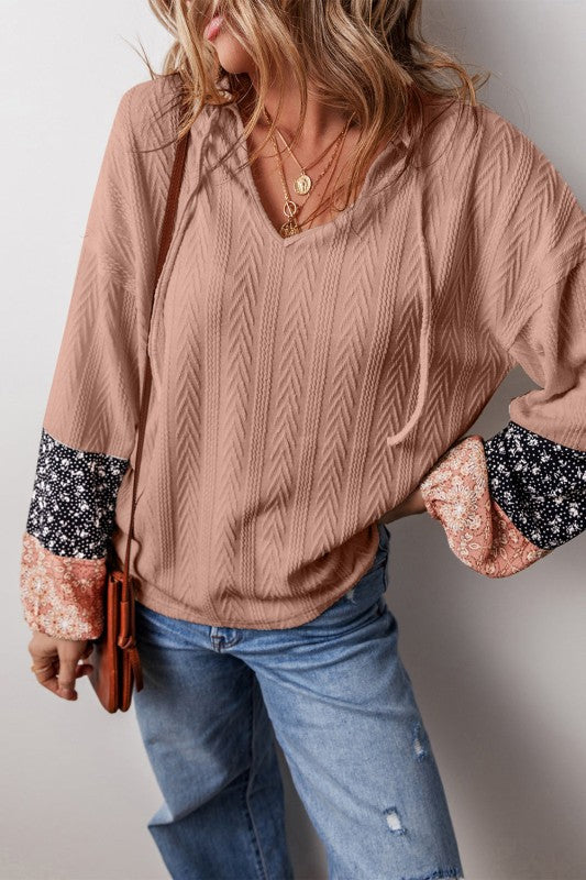 Balloon sleeves end in a relaxed cuff — comfortable movement. Imported from the United States.