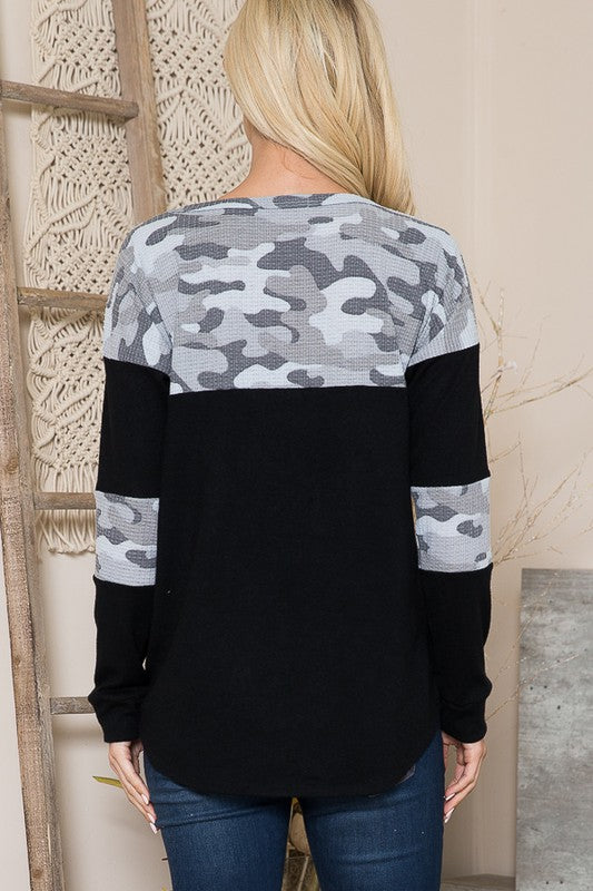 Soft and breathable knit with camouflage accents for casual flair.