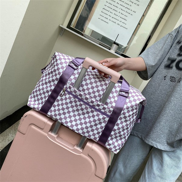 Checkered print duffel bag with a shoulder strap and top handles, ideal for gym or travel.