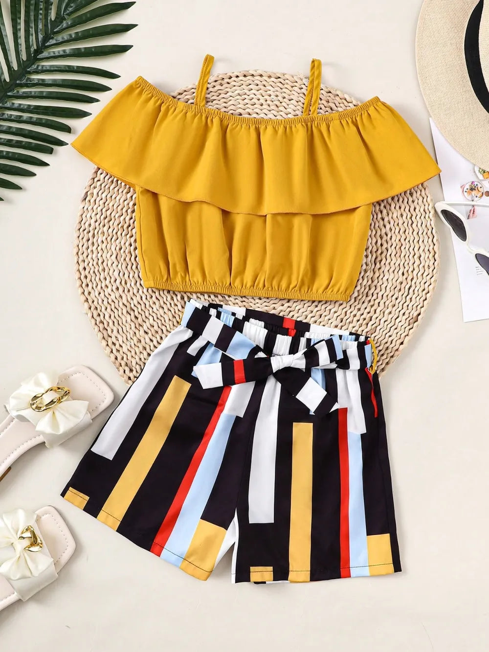 Children’s matching set: spaghetti strap ruffle top paired with soft pants, made for comfort and style
