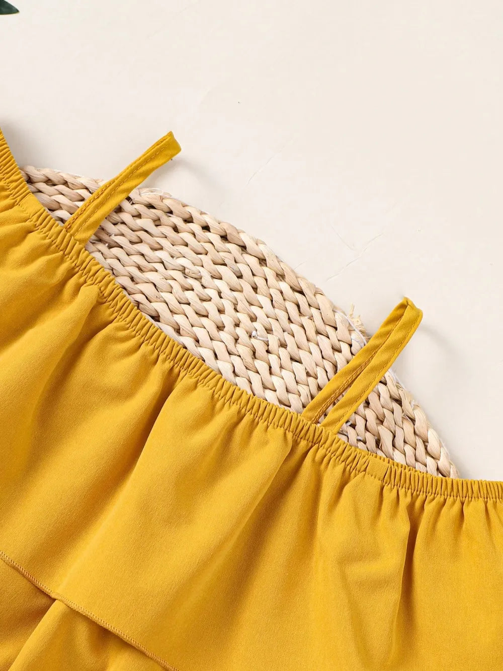 Children’s matching set: spaghetti strap ruffle top paired with soft pants, made for comfort and style