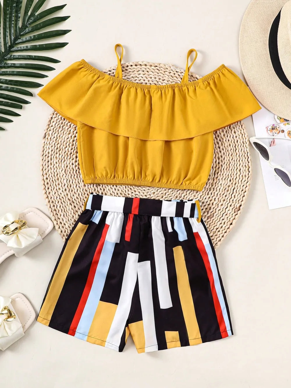 Children’s matching set: spaghetti strap ruffle top paired with soft pants, made for comfort and style