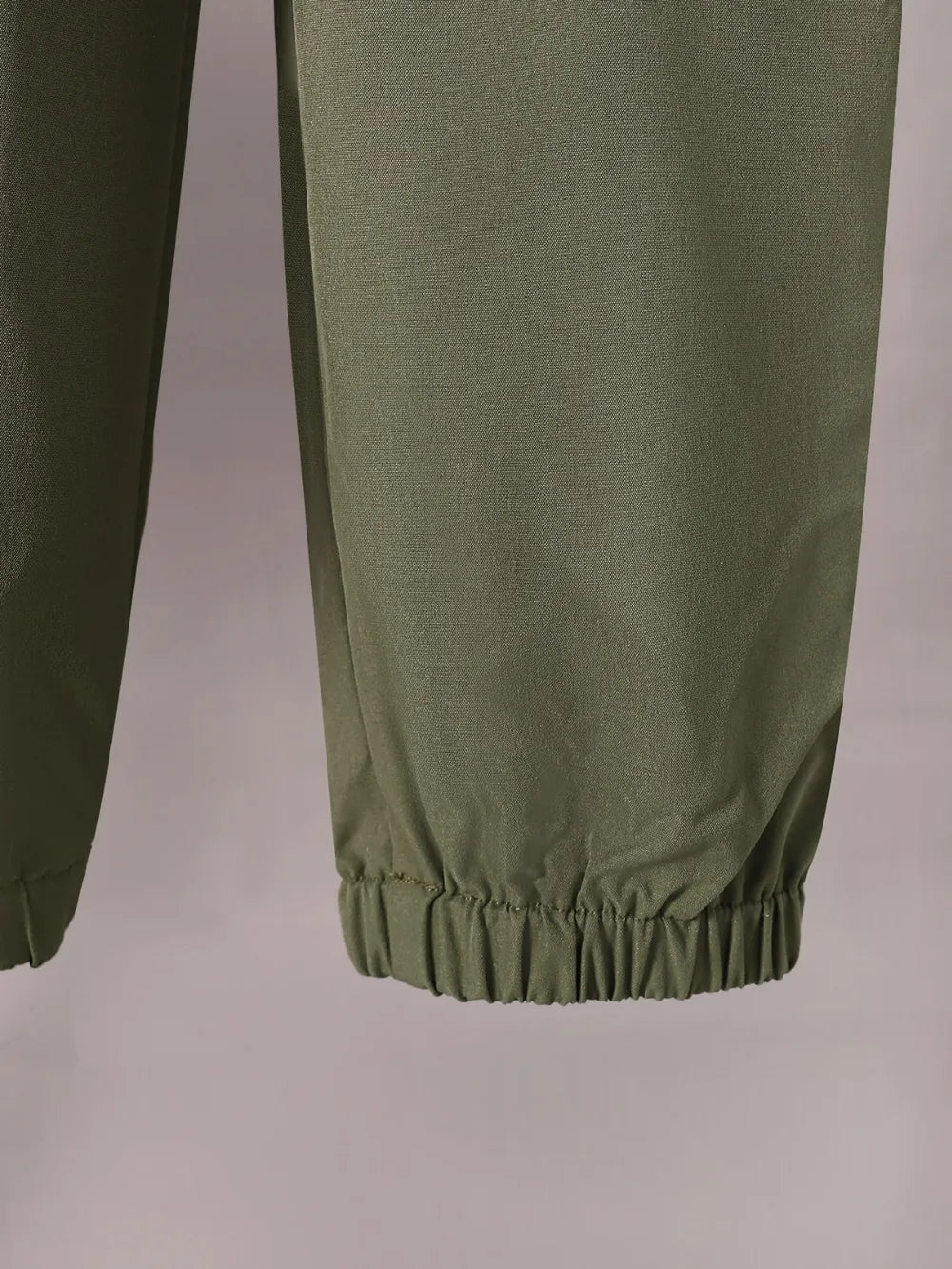 Green pants on a plain background