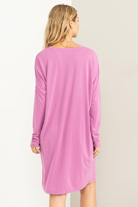 A woman models a comfortable, oversized Midi Dress with a relaxed fit, perfect for casual wear, back view.