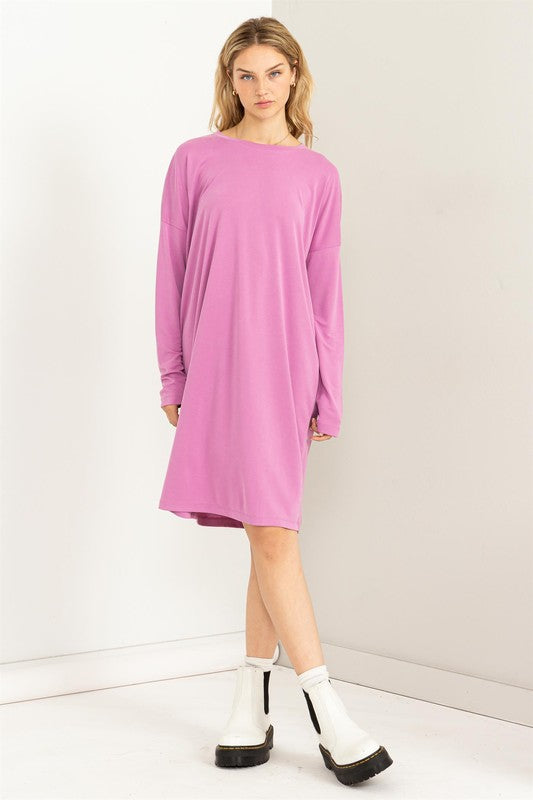 A woman models a comfortable, oversized Midi Dress with a relaxed fit, perfect for casual wear, front view.