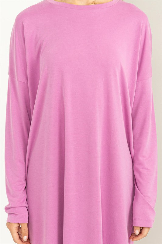 A woman models a comfortable, oversized Midi Dress with a relaxed fit, perfect for casual wear, close up.