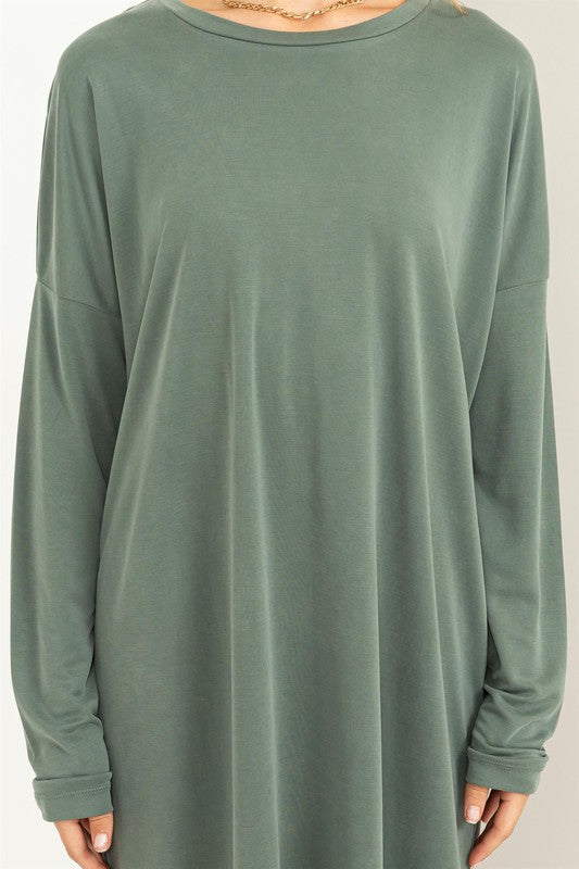 A woman models a comfortable, oversized Midi Dress with a relaxed fit, perfect for casual wear, close up view.
