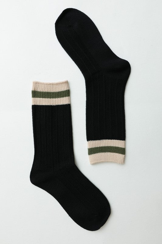 Black ribbed crew socks with striped cuffs, a versatile addition to any wardrobe.