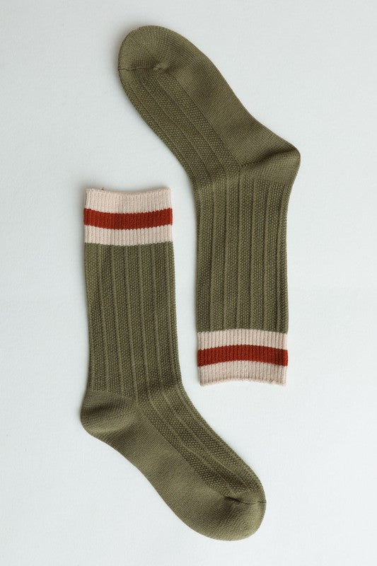 Olive green ribbed crew socks with striped cuffs, for a trendy earthy touch, close up