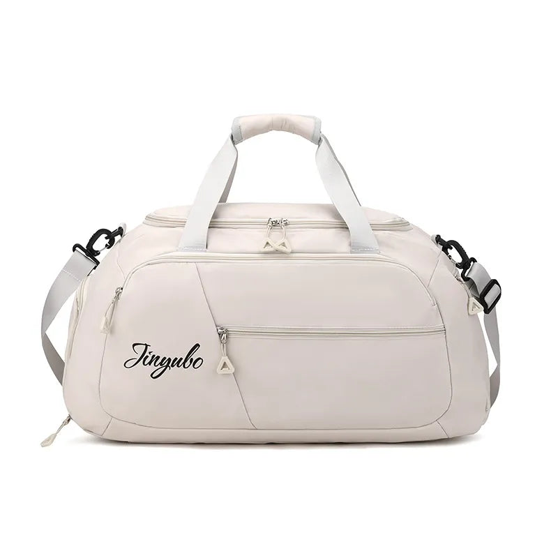 Light beige duffel bag with "Jinyubo" branding, featuring a sleek design with zippered front and side pockets, padded handles, and an adjustable shoulder strap. Stylish and functional—great for travel, gym, or daily use.