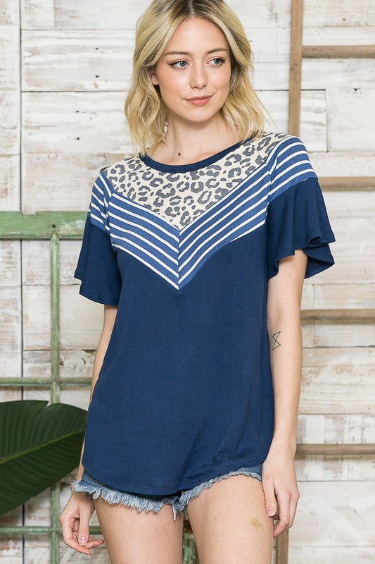 Flirty ruffles meet comfortable knit for a balanced everyday top.
