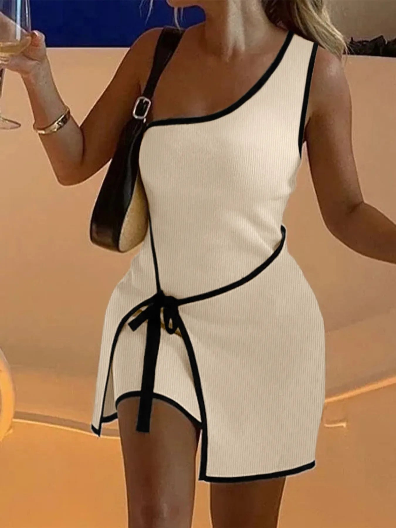 One-shoulder mini dress with contrast trim detail and fitted silhouette — modern, stylish piece ideal for party wear