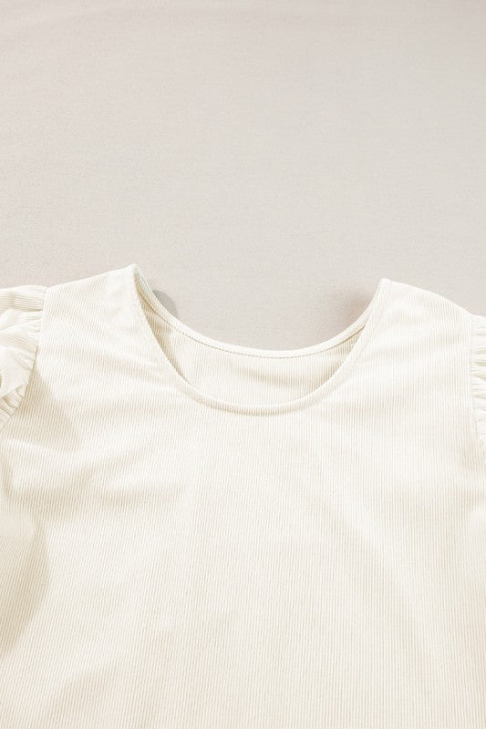 Designed with a flattering round neckline for effortless wear.