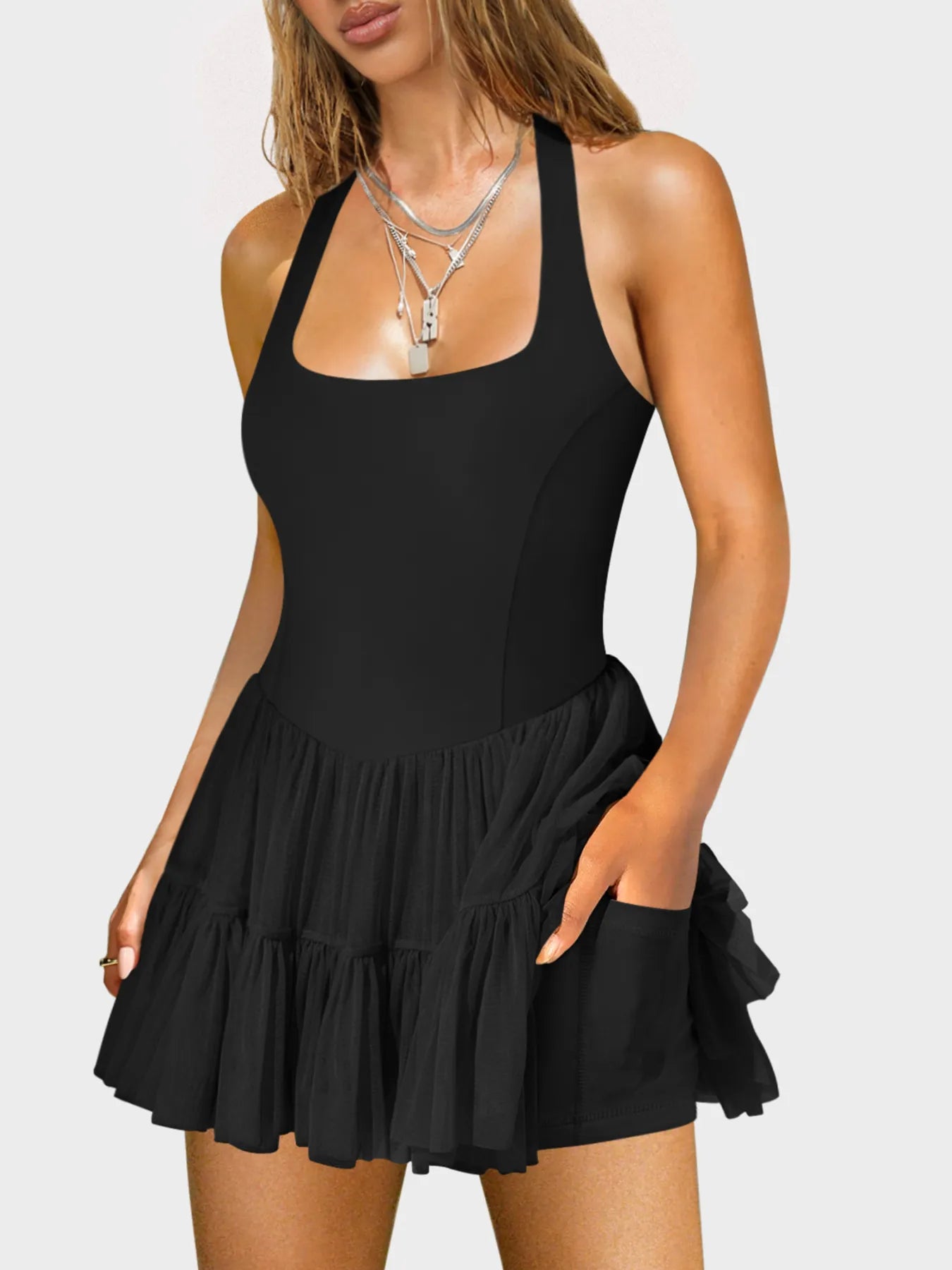 Mini dress with square neckline and crisscross back straps, fitted silhouette — stylish and eye-catching for evening wear or parties