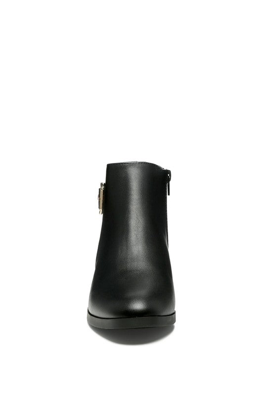 A decorative strap with a gold-tone buckle runs around the outer side near the ankle.