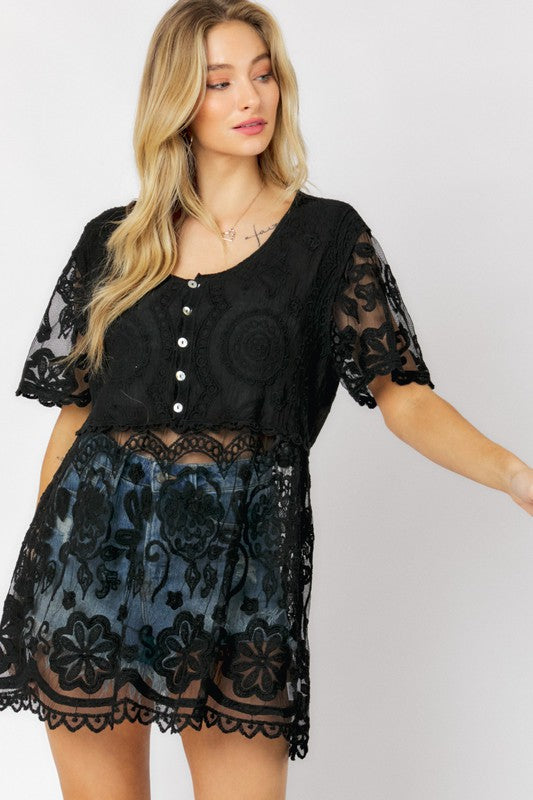 Button-down styling makes this crochet top versatile for both casual and dressier looks.