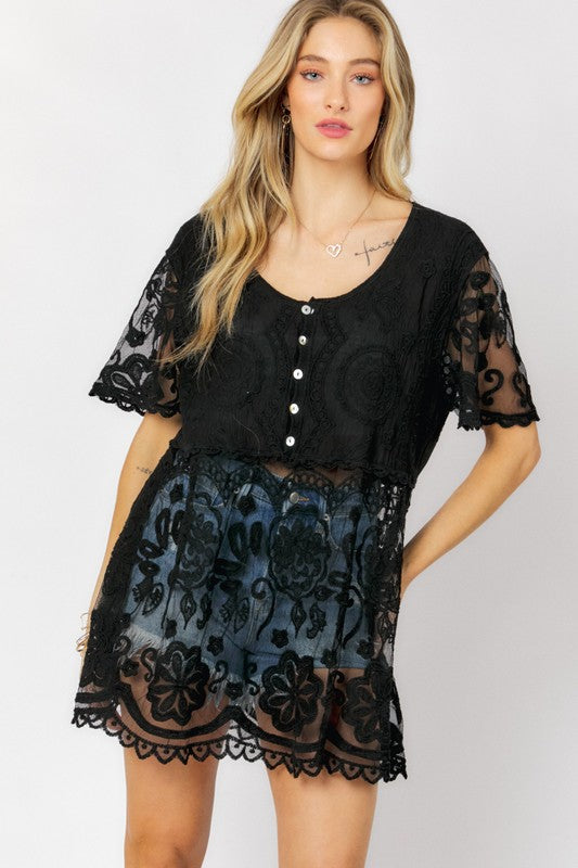 Effortless elegance: crochet texture meets easy button closure.