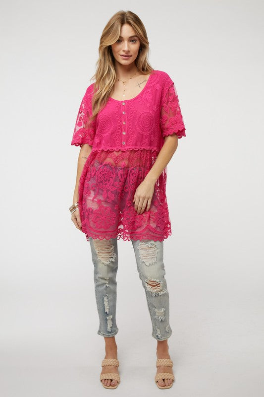 The button-down crochet design marries vintage charm with modern versatility.
