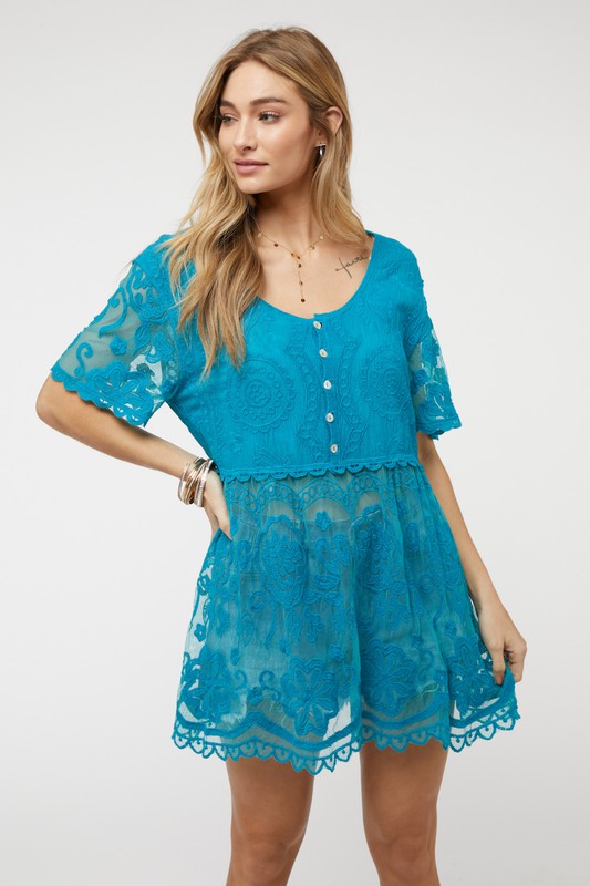 This crochet button top adds artisan detail to your everyday wardrobe.