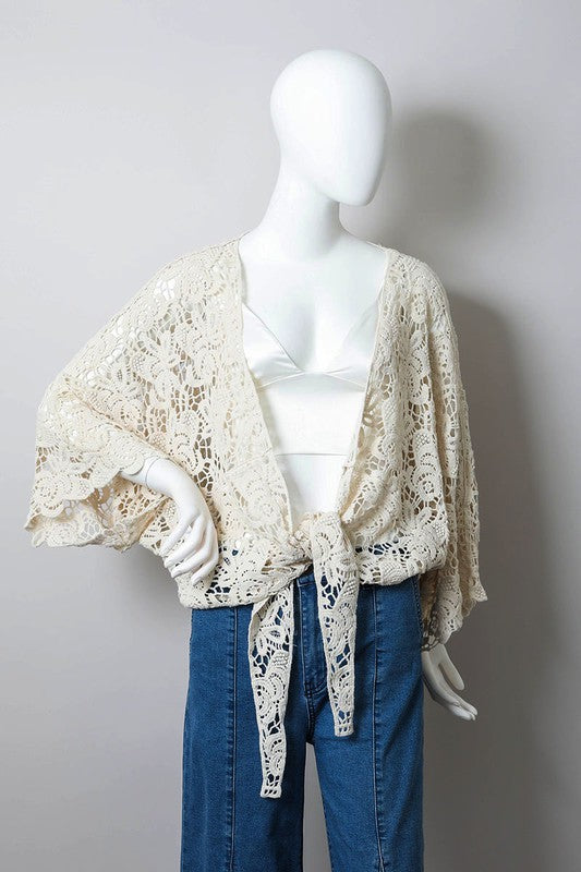 Flowy sleeves and tie-front styling make this piece elegant yet effortless.