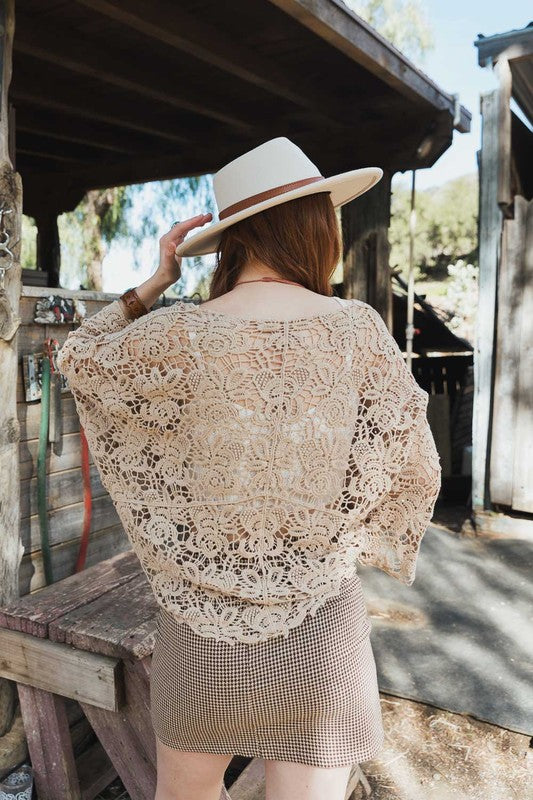 One size fits most design with generous drape and versatile coverage.
