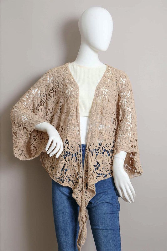Sheer crochet weave offers delicate coverage without heaviness.