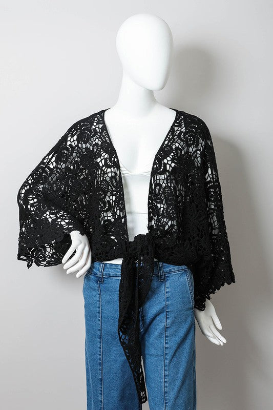 This kimono wrap merges crochet elegance with versatile layering ease.