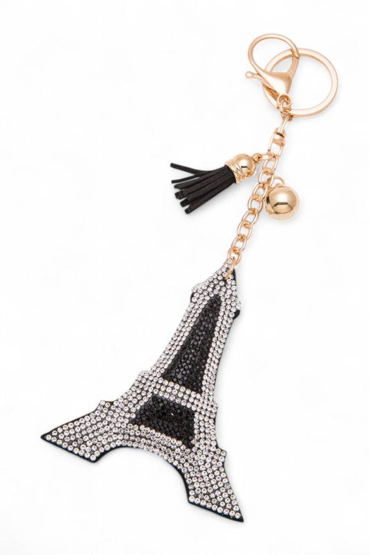 Gold Eiffel Tower keychain with sparkling rhinestones, black tassel, and charm accents, elegant and perfect as a chic accessory or Paris-inspired gift.