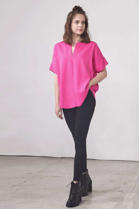 Dolman short sleeves offer a relaxed and airy silhouette.