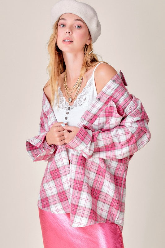 Long sleeves with buttoned cuffs to roll up when needed.