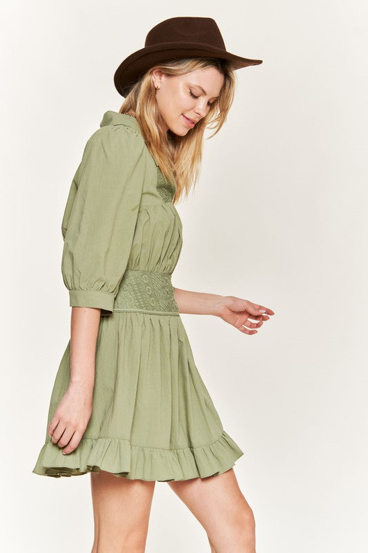 Ruffled trim at the hem adds feminine flair and movement.