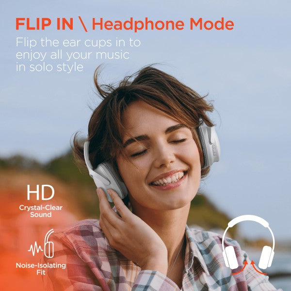 A person wearing over-ear headphones is smiling with eyes closed in an outdoor setting, enjoying music. Promotional text highlights features like "Flip In Headphone Mode," HD crystal-clear sound, and a noise-isolating fit.