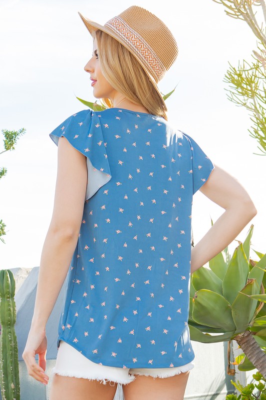 This top blends subtle texture and flowy sleeves for a refined look.