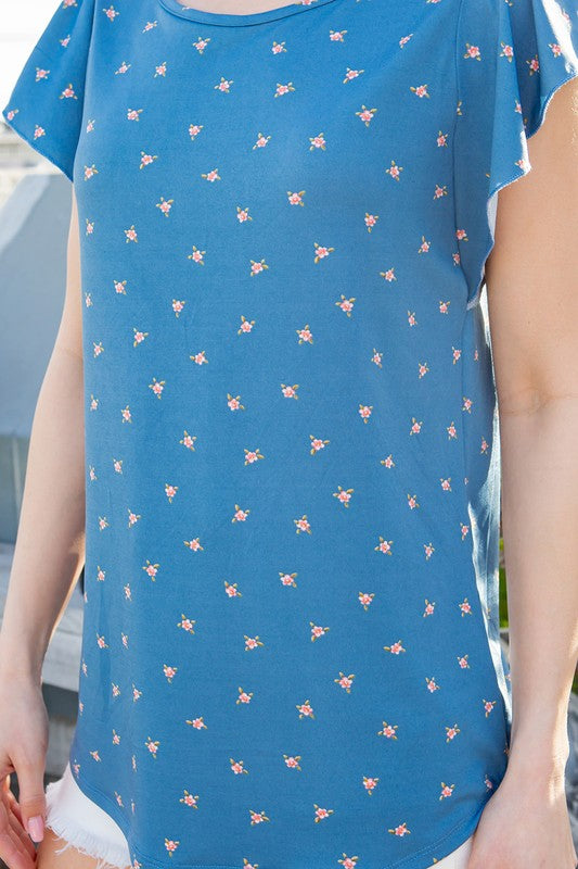 From casual days to dressier evenings, the flutter detail makes this knit top stand out.