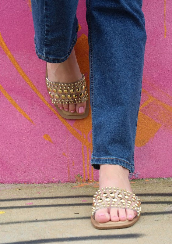 Slip-on sandals with pearl and stud embellished upper band, square toe silhouette, flat sole, and open-toe design