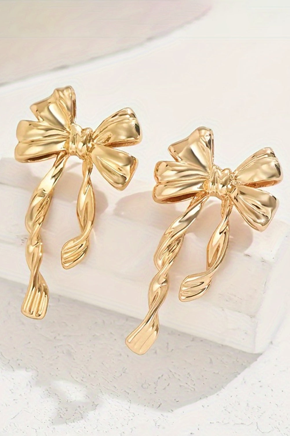 Sweet, simple, and effortlessly chic. These gold bow knot stud earrings are the kind of accessory that adds a touch of charm without saying a word. With their delicate design and polished finish, they’re perfect for everyday wear or adding a little sparkle to a special moment.