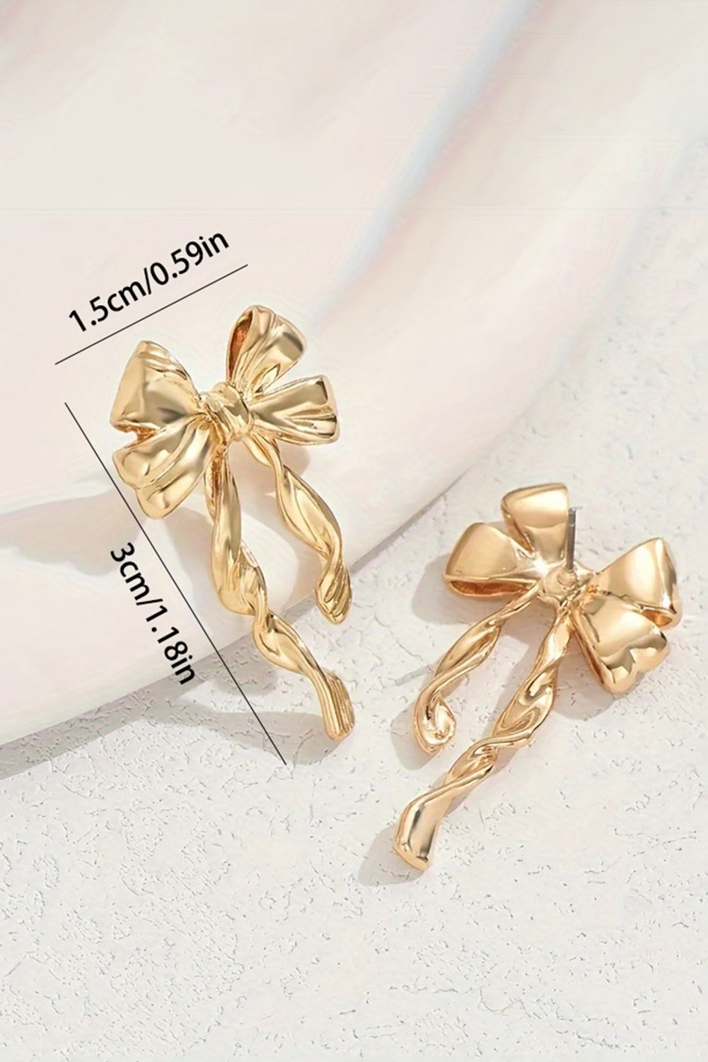 Sweet, simple, and effortlessly chic. These gold bow knot stud earrings are the kind of accessory that adds a touch of charm without saying a word. With their delicate design and polished finish, they’re perfect for everyday wear or adding a little sparkle to a special moment.